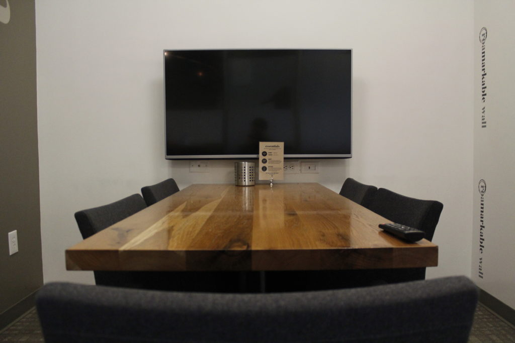 Conference room seating up to 5 people; LED screen + whiteboard included