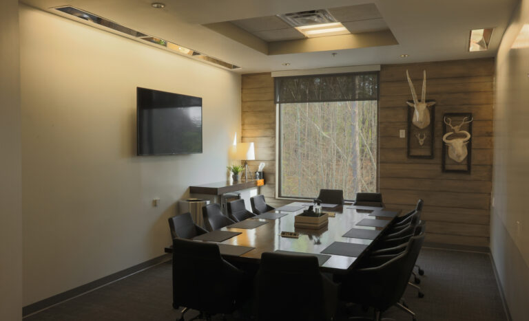 Spacious boardroom with LED screen and whiteboard wall